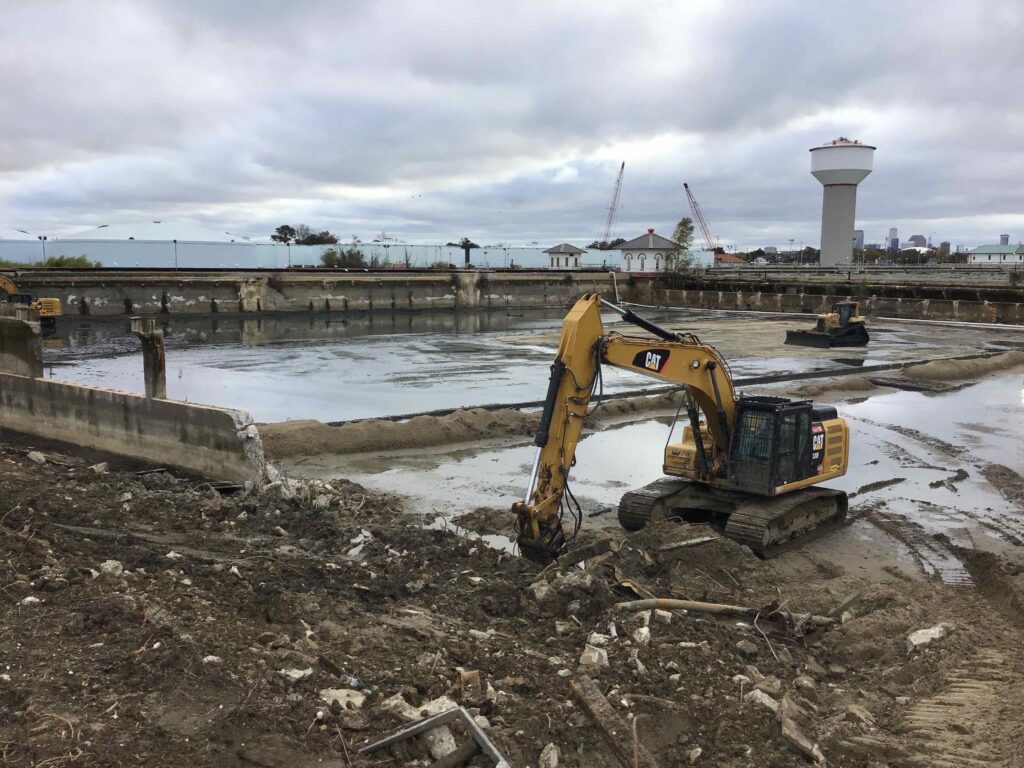 Heavy machinery at a demolition and site preparation site.