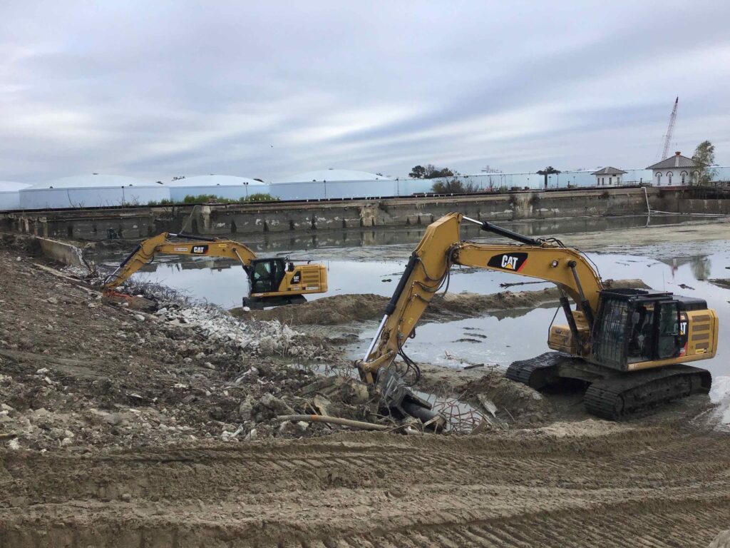 Heavy machinery at a demolition and site preparation site.