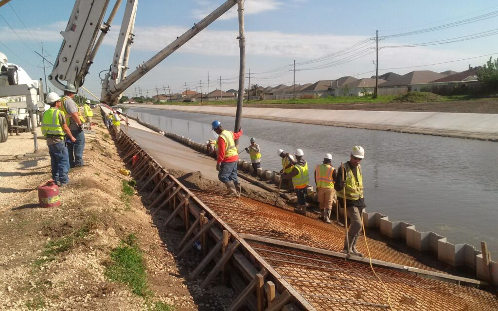 Cycle Construction's workers setting up slope paving for Gardere Canal Phase III and Murphy Canal Phase I