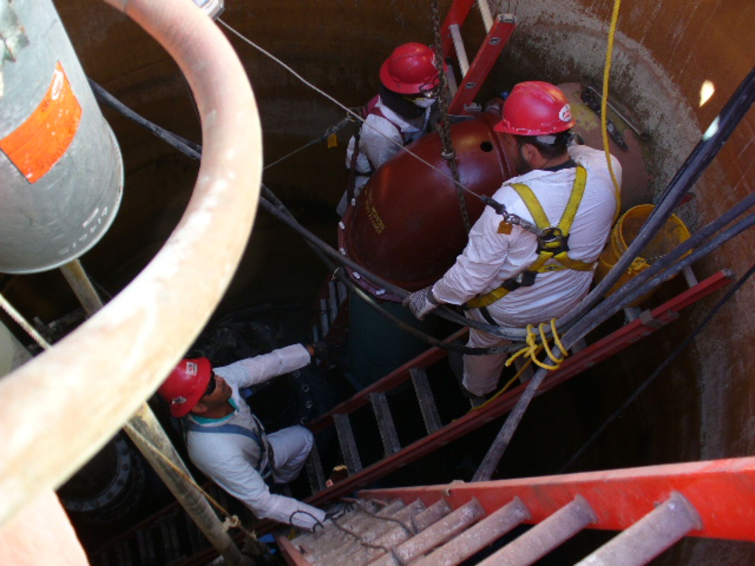 Job site photo of Cycle Construction's workforce in red hard hats